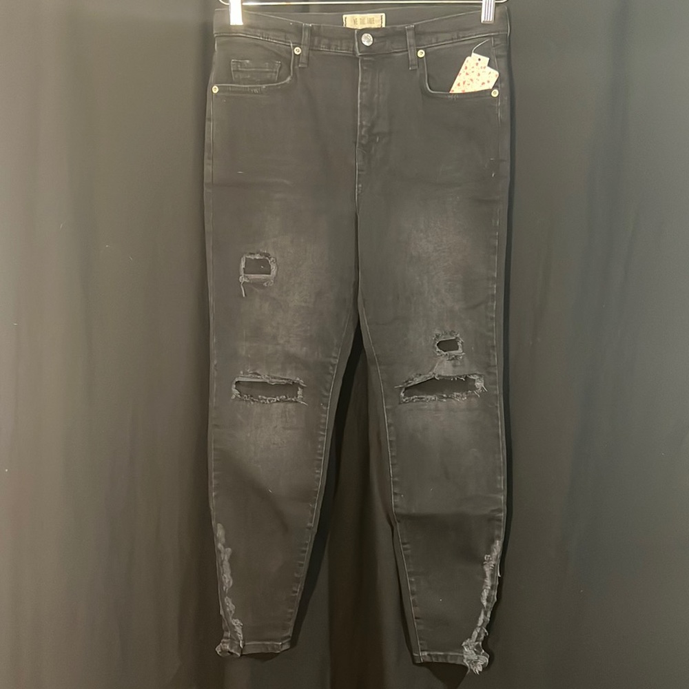 Free People distressed black mega-skinny 5-pocket jeans w/distressed areas